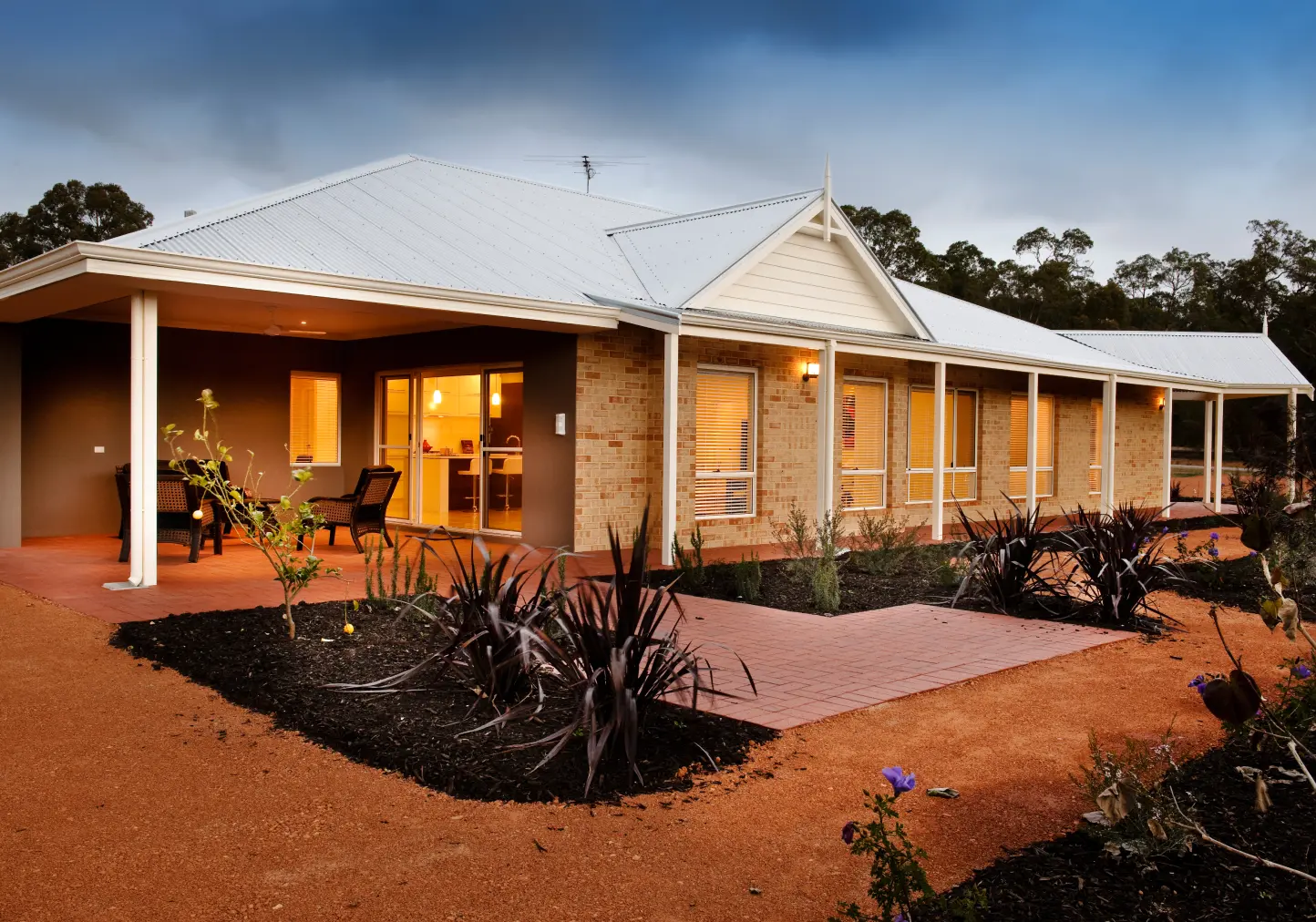 A flat house from the outside view with plants on the sides