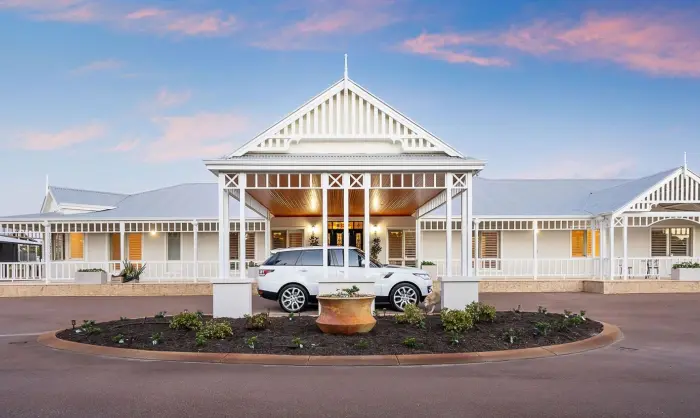 One story house design with a car on the entrance